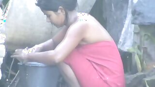 wow... outstanding desi village gal bathing outside