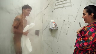 Big ass stepmom ends up fucking her skinny stepson after snooping on him in the shower